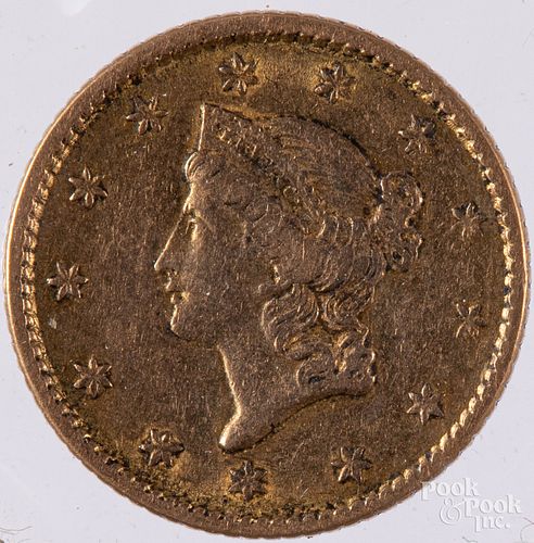 1853 Liberty Head one dollar gold coin.