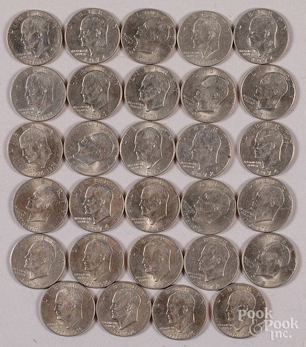 Twenty-nine Eisenhower silver dollars, 1971-1976.