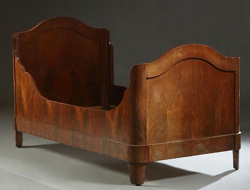 French Empire Carved Mahogany Daybed, 19th c., the arched head and foot board joined by a large curved front rail, and a wide finished back rail, H.- 
