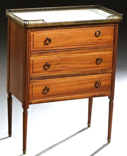 French Louis XVI Style Carved Mahogany Marble Top Petite Commode, 20th c., the 3/4 pierced brass gallery around a figured white marble over a bank of 