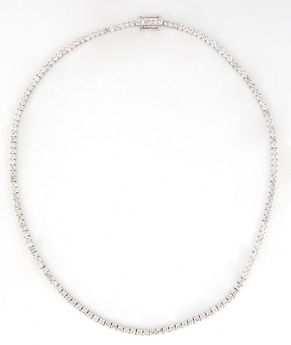14K White Gold Tennis Necklace, each of the 156 links with a graduated round diamond, total diamond weight- 15.16 cts., L.- 17 in., with appraisal.