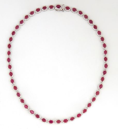 Lady's Platinum Link Necklace, each of the 47 links with an oval ruby atop of border of tiny round diamonds, total ruby weight- 22.91 cts., total diam