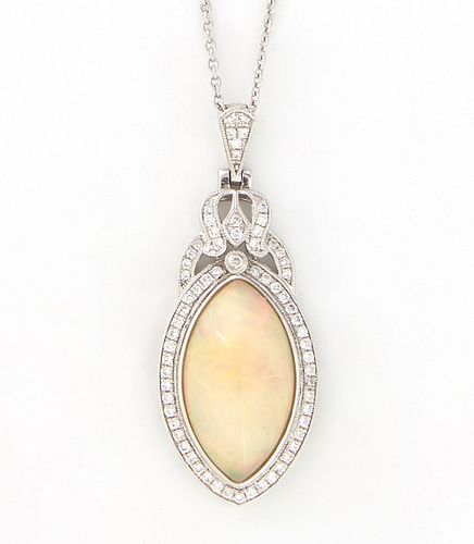 Lady's Platinum Pendant, with a marquise 8.04 carat cabochon opal atop a border of tiny round diamonds, with a pierced diamond mounted bezel and a dia