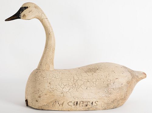 Painted hollow bodied swan decoy