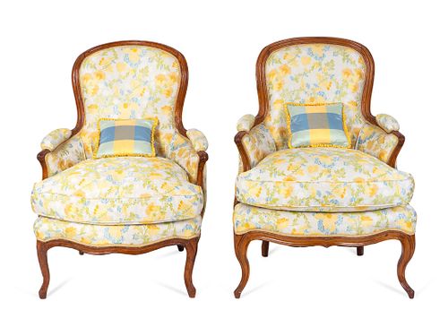 A Pair of Louis XV Style Carved Walnut Bergeres
Height 36 1/2 x width 26 1/2 inches.