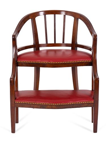 A Georgian Style Mahogany and Red Leatherette Library Chair
Height 30 x width 23 3/4 x depth 21 inches.