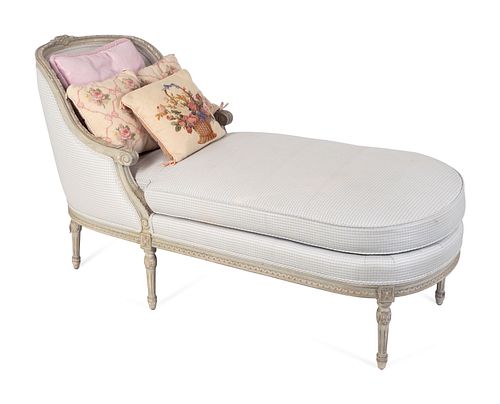 A Louis XVI Style Carved and Grey Painted Chaise Longue
Height 36 x length 66 x width 26 inches.