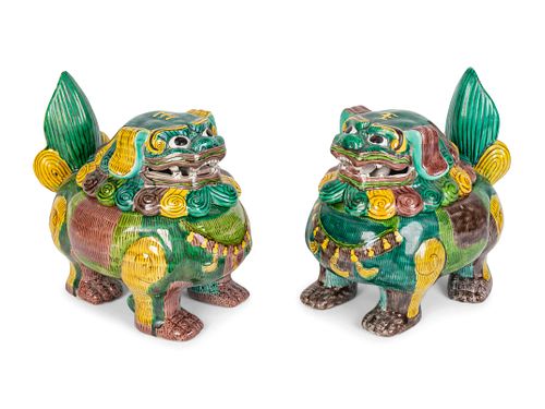 A Pair of Chinese Sancai Glazed Porcelain Mythical Beast-Form Incense Burners
Height 7 1/2 x width 8 3/4 inches.