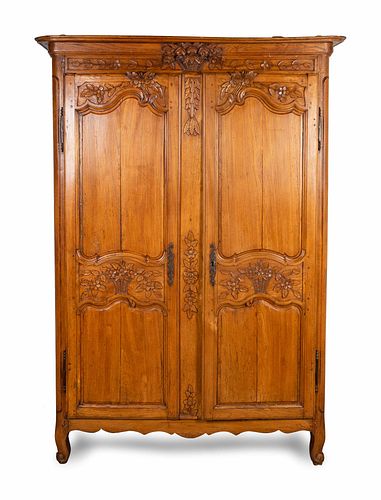 A Louis XV Provincial Carved Fruitwood Armoire
Height 82 x width 52 x depth 19 1/2 inches.