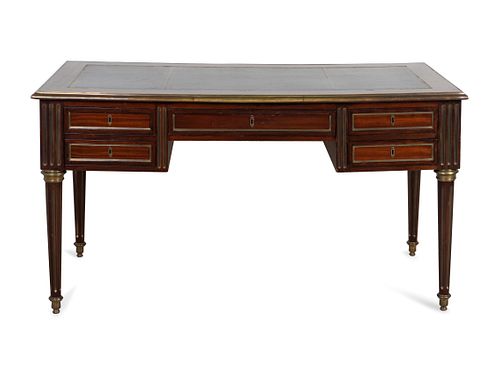 A Directoire Style Brass-Mounted Mahogany Bureau Plat
Height 29 3/4 x length 54 x depth 29 inches.