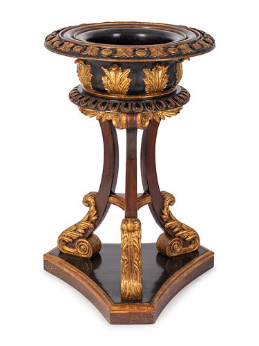 A Regency Style Parcel-Gilt and Ebonized Mahogany Jardiniere 
Height 39 x top diameter 26 inches.