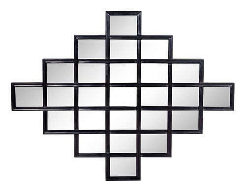 A Contemporary Black Framed Mirror by Christopher Guy
Height 38 1/2 x width 49 1/4 inches.