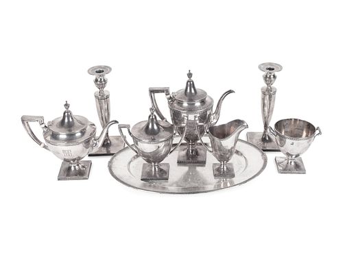 An American Silver Tea and Coffee Service with Oval Tray and Pair of Weighted Candlesticks
Coffee pot, height 10 inches.