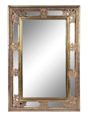 A Baroque Style Repouseed Brass and Beveled Glass Rectangular Mirror
Height 36 x width 24 inches.