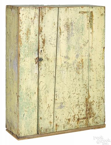 New England painted pine wall cupboard, 19th c., retaining an old scrubbed yellow surface