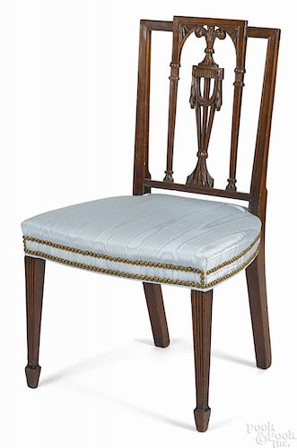 New York Federal mahogany dining chair, ca. 1805, having a carved square back with swag urn