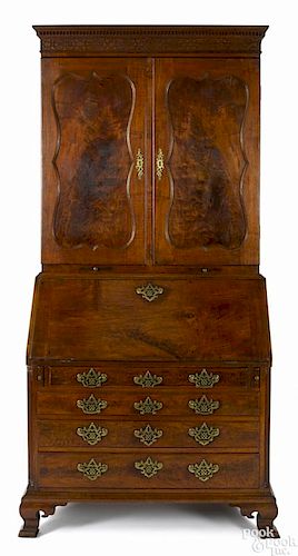 Pennsylvania Chippendale walnut desk and bookcase, ca. 1765, the upper section with blind fretwork