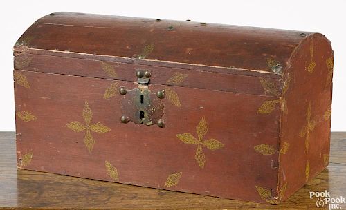New England painted basswood dome top box, 19th c., with the original yellow stamped flowers