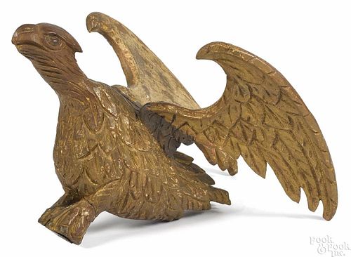 Carved and gilt spread winged eagle, 19th c., 13 1/2'' h., 15 1/2'' w.