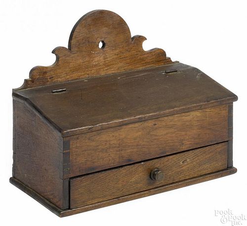 Pennsylvania walnut wall box, ca. 1800, with a scrolled crest and a single, full-width drawer