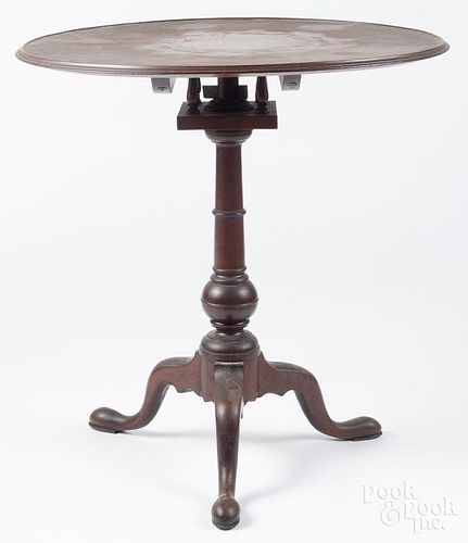 Pennsylvania Queen Anne walnut candlestand, ca. 1770, with a birdcage and a ball turned standard