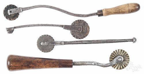 Four Pennsylvania wrought iron pie crimpers, 19th c., two with copper wheels, one with brass