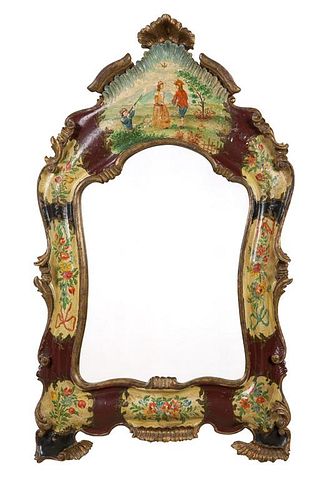 A Venetian carved and polychromed wall mirror