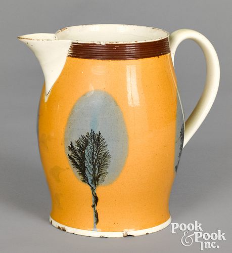 Mocha pitcher with seaweed over fan decoration