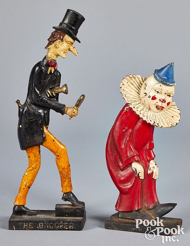 Two painted cast iron doorstops
