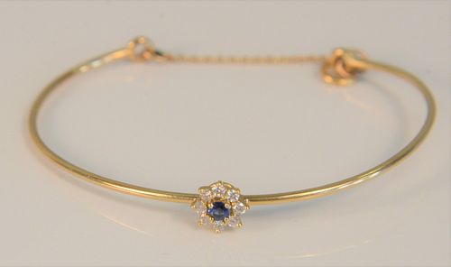 14K bracelet set with blue stone surrounded by eight diamonds. 5.4 grams
Provenance: The Estate of Diana Atwood Johnson
