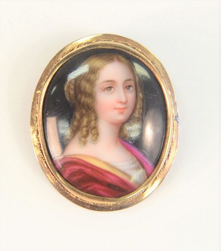 14 Karat Framed Brooch
with painting on porcelain of a young woman
length 1-1/4 inches