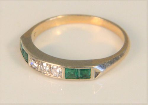 14K Yellow Gold Ring 
set with three diamonds flanked by two emeralds on either side
size 6
Provenance: The Estate of Diana Atwood Johnson