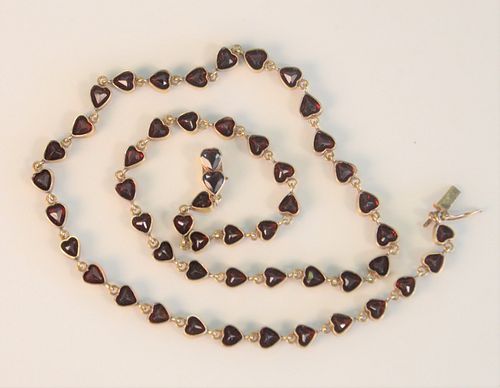 Gold Necklace 
set with heart shaped garnets
length 18 1/2 inches, total weight 18.5 grams
Provenance: From the Lance & Irma Keller Collection, Bloomf