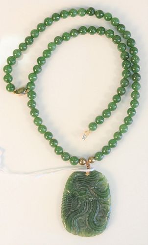Green jade bead necklace with carved green jade pendant, necklace length 22 inches