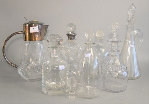 Eight Glass Decanters including two signed 'R Lalique', plus extra stopper, one large Bohemian,
heights ranging from 9 inches to 19 1/2 inches