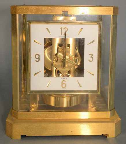 Jaeger-LeCoultre Atmos Clock
brass and glass case with square face
height 9 1/4 inches