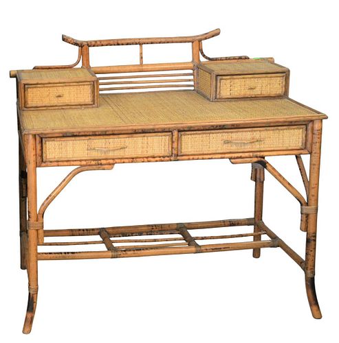 Bamboo and Rattan Desk
having four drawers
height 39 1/2 inches, top 22 1/2" x 41 1/2"