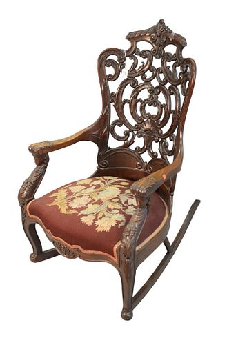 Victorian Rocker
with laminated, pierce carved back, and figural arm supports, with needlepoint seat
height 42 inches
Provenance: Matthes-Theriault Co