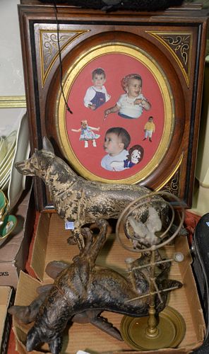 Six Piece Lot 
to include three metal dog doorstops; one metal keystand with parrot motif; one kettle stand; along with a Ditson banjo
Provenance: Thi