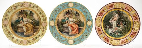 A GROUP OF THREE PORCELAIN PLATES WITH PAINTINGS BY HANS ZATZKA, LATE 19TH-EARLY 20TH CENTURY