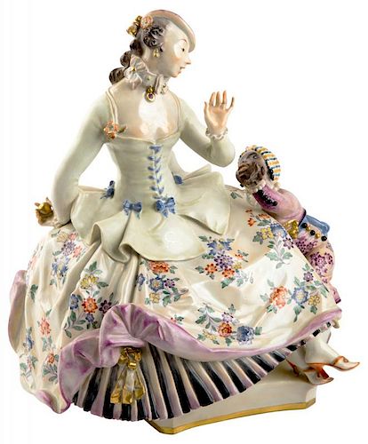 A PORCELAIN GROUP OF A LADY WITH A YOUNG MOOR BOY, MEISSEN, AFTER A MODEL BY PAUL SCHEURICH
