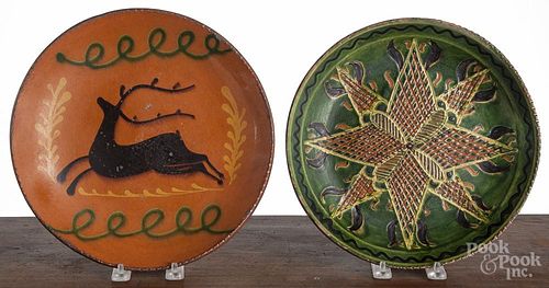 Two Greg Shooner redware plates, signed and dated 1996 and 2002, 11'' dia. and 10 1/2'' dia.
