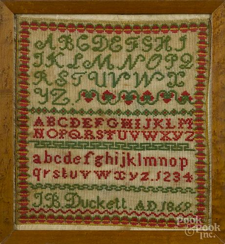 Wool on linen sampler, dated 1869, wrought by J. B. Duckett, 12 1/2'' x 11 1/4''.