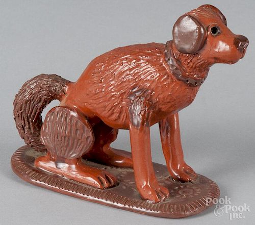 Contemporary redware figure of a seated hound, signed Winer, on a slab base, 5'' h.