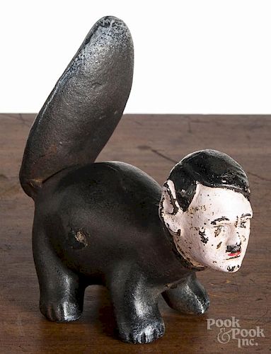 Cast iron Hitler the skunk, mid 20th c., 5'' h.