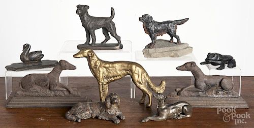 Metalware dogs, 19th/20th c., to include cast iron, spelter, and bronze examples, largest - 9'' l.