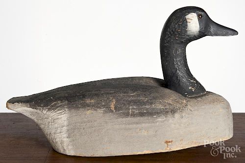 Herters carved and painted goose decoy, mid 20th c., 18'' l.
