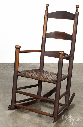 Painted ladderback rocking chair, 19th c., retaining an old Spanish brown surface.