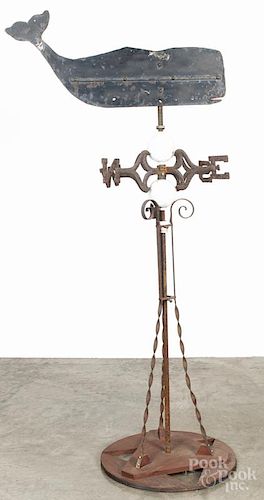 Sheet iron whale weathervane, 20th c., with an iron stand and milk glass lightning balls, 69'' h.