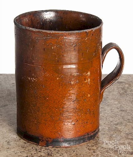 Pennsylvania redware mug, 19th c., with manganese splash decoration, 6 1/4'' h.
